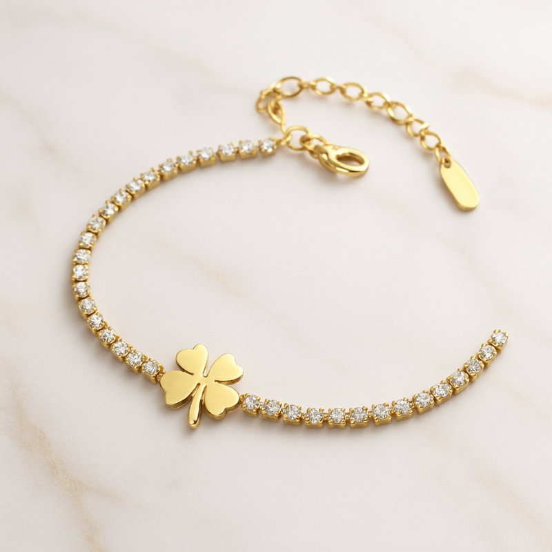 Gold Bracelet with a four-leaf clover charm and diamond-like stones